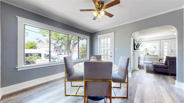 243 N Verdugo Rd, Glendale, CA 91206 - dining space with ceiling fan, arched walkways, ornamental molding, and wood finished floors