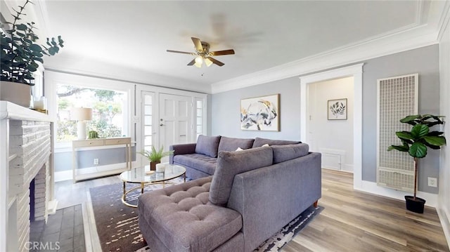 243 N Verdugo Rd, Glendale, CA 91206 - living area with a heating unit, a ceiling fan, a fireplace, ornamental molding, and wood finished floors