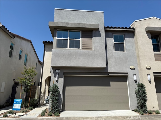 15929 Blue Copper Way, Fontana, CA 92336 - view of front facade with a tile roof, stucco siding, and a garage