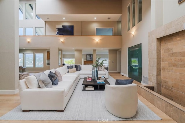 15541 Aqua Verde Dr, Los Angeles, CA 90077 - living room with a towering ceiling, wood finished floors, and recessed lighting