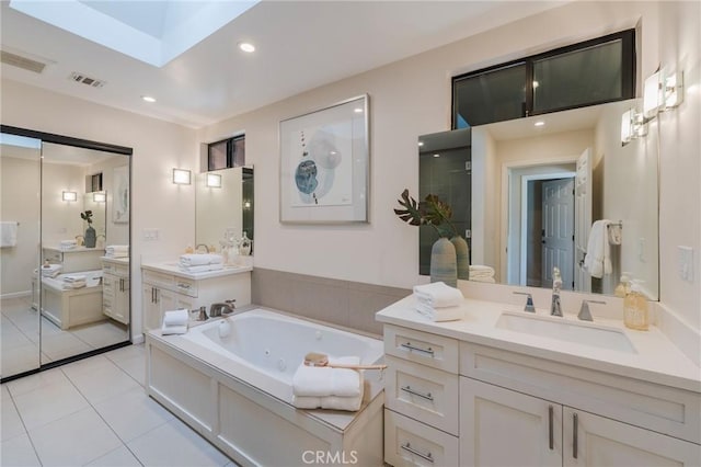 15541 Aqua Verde Dr, Los Angeles, CA 90077 - bathroom with vanity, a jetted tub, tile patterned floors, and recessed lighting