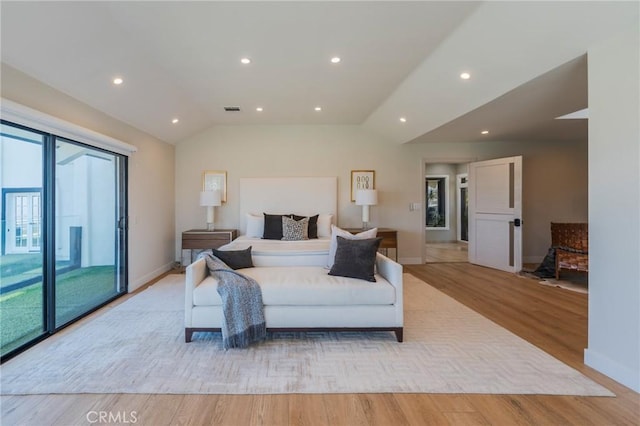 15541 Aqua Verde Dr, Los Angeles, CA 90077 - bedroom with access to exterior, light wood-type flooring, vaulted ceiling, and recessed lighting