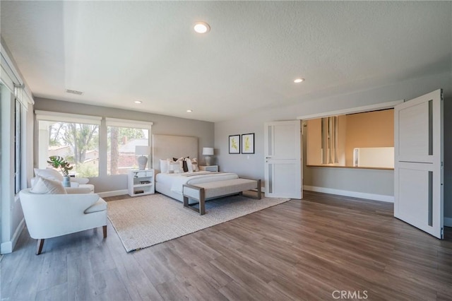 15541 Aqua Verde Dr, Los Angeles, CA 90077 - bedroom featuring wood finished floors and recessed lighting