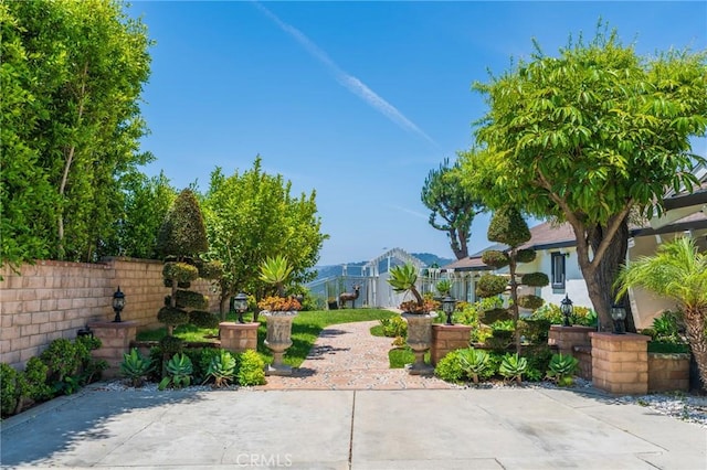 15541 Aqua Verde Dr, Los Angeles, CA 90077 - surrounding community with a patio area