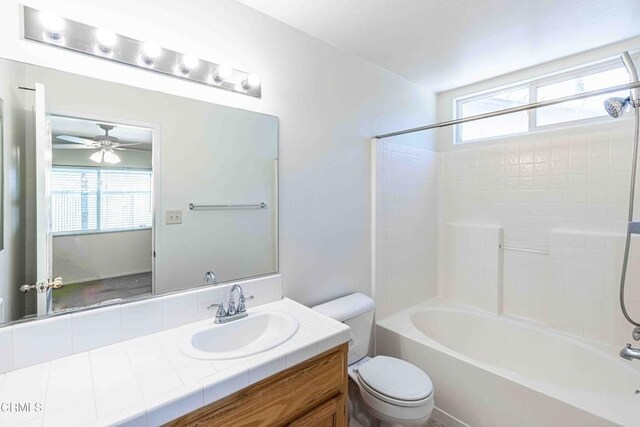 4810 Bluestone Dr, Bakersfield, CA 93311 - bathroom featuring vanity, shower / bathtub combination, plenty of natural light, and ceiling fan