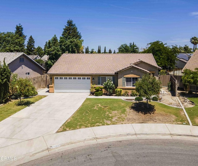 4810 Bluestone Dr, Bakersfield, CA 93311 - view of front of home with a tile roof, an attached garage, stucco siding, and concrete driveway