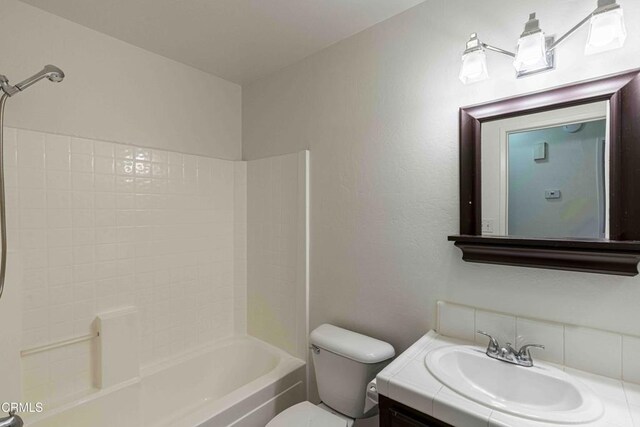4810 Bluestone Dr, Bakersfield, CA 93311 - bathroom featuring vanity, bathing tub / shower combination, and decorative backsplash