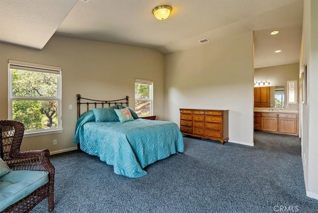 8412 Alta Vista Ave, Atascadero, CA 93422 - bedroom with dark colored carpet, multiple windows, connected bathroom, and recessed lighting