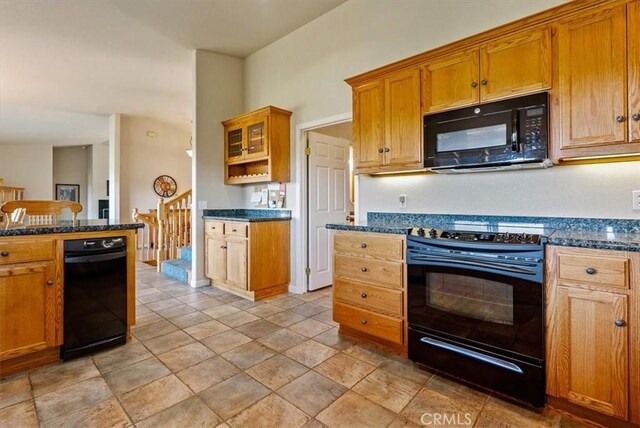 8412 Alta Vista Ave, Atascadero, CA 93422 - kitchen featuring black appliances, brown cabinets, dark stone countertops, and glass insert cabinets