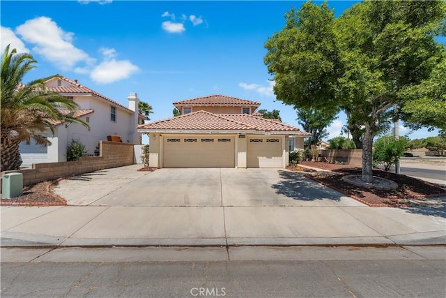 44559 Aspen St, Lancaster, CA 93535 - mediterranean / spanish-style house with stucco siding, concrete driveway, an attached garage, and a tiled roof