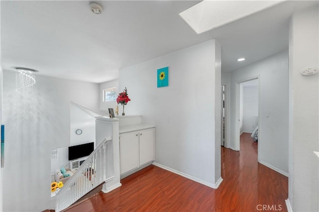 44559 Aspen St, Lancaster, CA 93535 - corridor featuring an upstairs landing, wood finished floors, a skylight, and recessed lighting