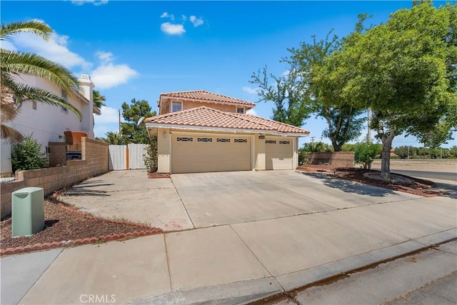 44559 Aspen St, Lancaster, CA 93535 - mediterranean / spanish house with a tiled roof, stucco siding, driveway, and a garage