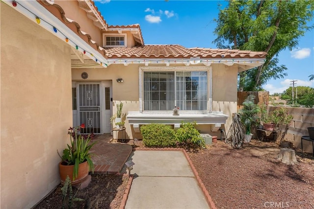 44559 Aspen St, Lancaster, CA 93535 - entrance to property featuring stucco siding and a tiled roof