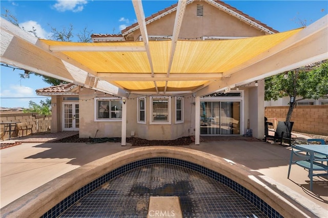44559 Aspen St, Lancaster, CA 93535 - back of property featuring stucco siding, a patio, and a tiled roof