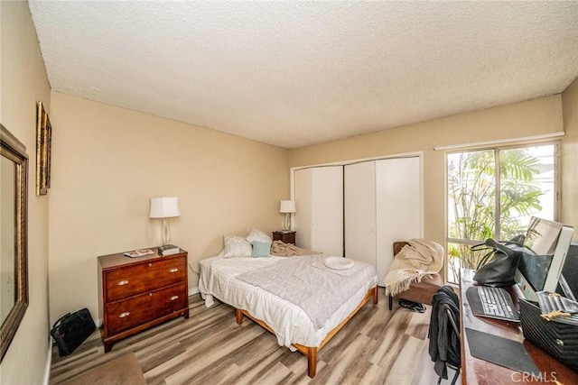 631 W 6th St Unit D, Tustin, CA 92780 - bedroom with a closet, wood finished floors, and a textured ceiling
