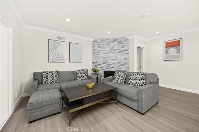 1834 E Stuart Ave, West Covina, CA 91791 - living room featuring wood finished floors, crown molding, recessed lighting, and a tile fireplace