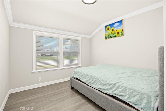 1834 E Stuart Ave, West Covina, CA 91791 - bedroom featuring ornamental molding, vaulted ceiling, and wood finished floors