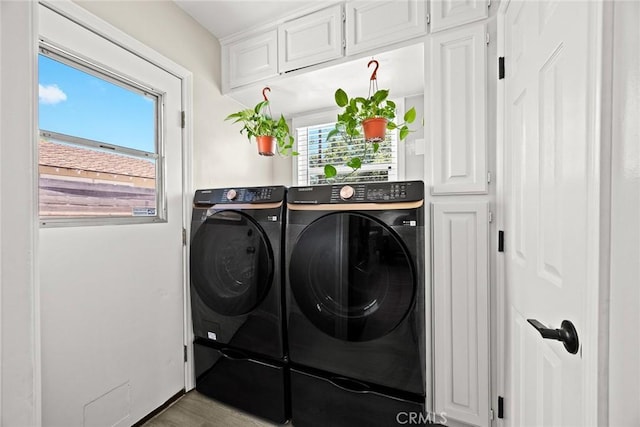 1834 E Stuart Ave, West Covina, CA 91791 - laundry room featuring washer and dryer, healthy amount of natural light, and wood finished floors