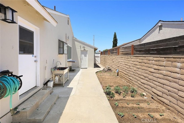 1834 E Stuart Ave, West Covina, CA 91791 - view of home's exterior with stucco siding, a fenced backyard, and a patio