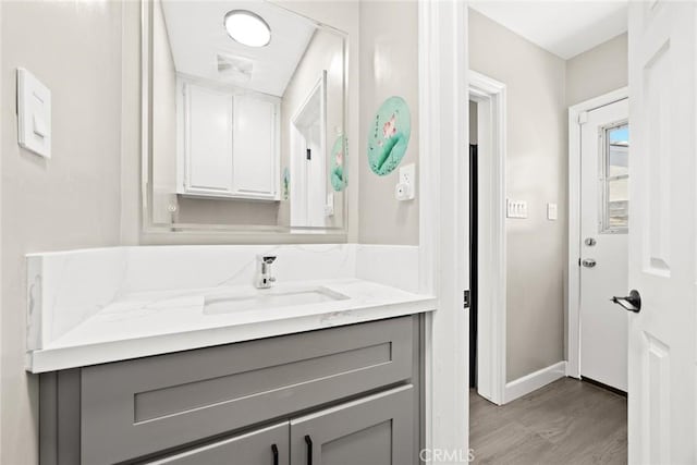 1834 E Stuart Ave, West Covina, CA 91791 - bathroom with wood finished floors and vanity