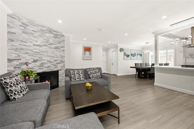 1834 E Stuart Ave, West Covina, CA 91791 - living room featuring ornamental molding, a tile fireplace, a chandelier, recessed lighting, and wood finished floors