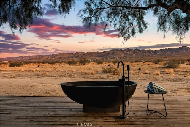 5725 Sunfair Rd, Joshua Tree, CA 92252 - deck at dusk with a mountain view