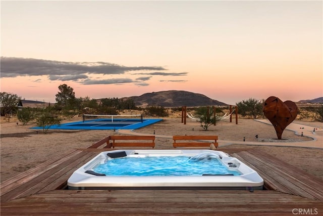 5725 Sunfair Rd, Joshua Tree, CA 92252 - view of pool with a tennis court and a deck with mountain view