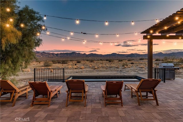 5725 Sunfair Rd, Joshua Tree, CA 92252 - view of patio / terrace with a mountain view, grilling area, a pergola, and view of desert landscape
