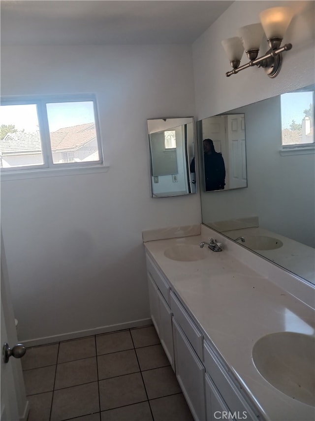 44738 Foxboro Ct, Lancaster, CA 93535 - bathroom featuring double vanity, healthy amount of natural light, and tile patterned floors