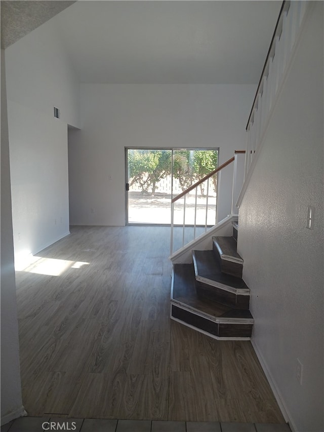 44738 Foxboro Ct, Lancaster, CA 93535 - stairs with wood finished floors and high vaulted ceiling