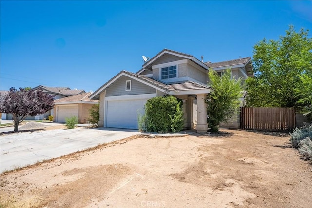 44738 Foxboro Ct, Lancaster, CA 93535 - view of front of house featuring a tiled roof, concrete driveway, and an attached garage