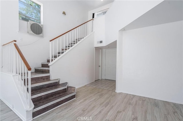 44738 Foxboro Ct, Lancaster, CA 93535 - stairway with wood finished floors and cooling unit
