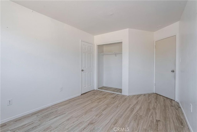 44738 Foxboro Ct, Lancaster, CA 93535 - unfurnished bedroom featuring light wood-type flooring and a closet