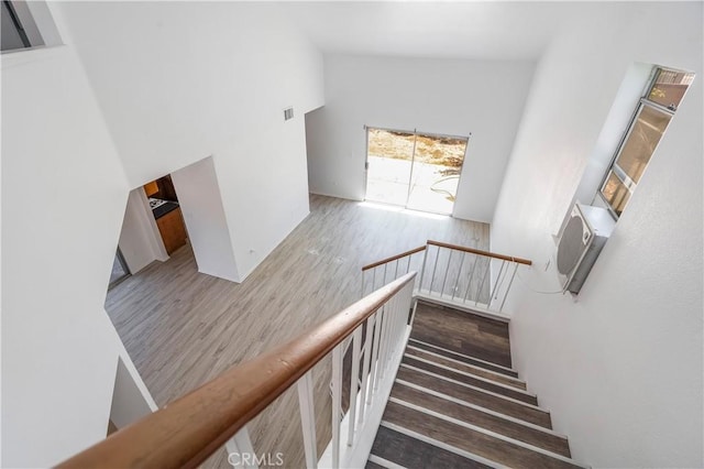 44738 Foxboro Ct, Lancaster, CA 93535 - stairway with high vaulted ceiling and wood finished floors