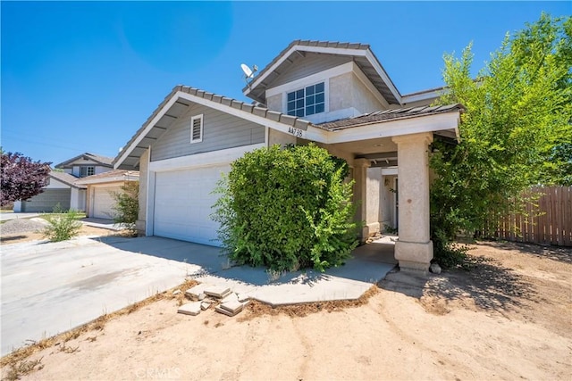 44738 Foxboro Ct, Lancaster, CA 93535 - view of front of property featuring a garage, a tile roof, and driveway