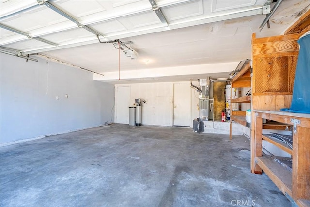 44738 Foxboro Ct, Lancaster, CA 93535 - garage featuring heating unit and a workshop area