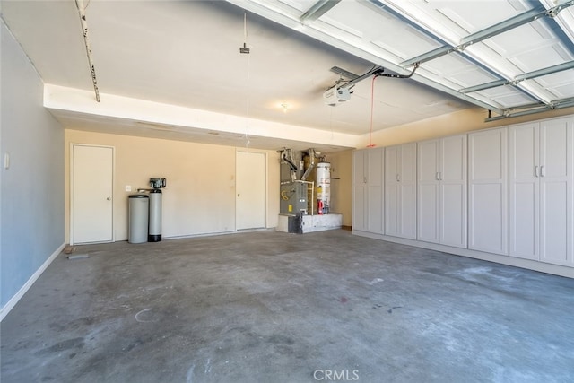 44738 Foxboro Ct, Lancaster, CA 93535 - garage with gas water heater, a garage door opener, and heating unit