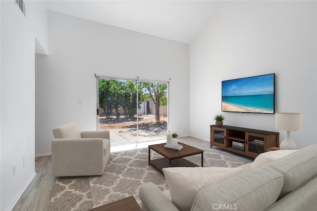 44738 Foxboro Ct, Lancaster, CA 93535 - living area with wood finished floors and high vaulted ceiling