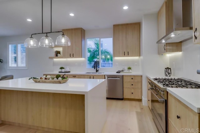 2850 Palmetto Point Ct, Chula Vista, CA 91915 - kitchen with appliances with stainless steel finishes, light brown cabinets, wall chimney range hood, light wood finished floors, and light countertops