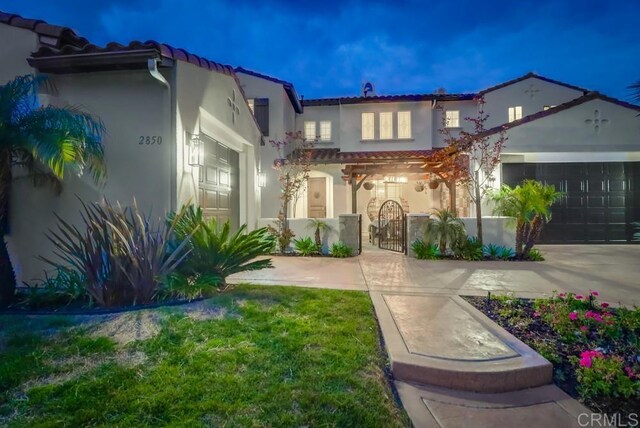 2850 Palmetto Point Ct, Chula Vista, CA 91915 - mediterranean / spanish home with a tiled roof, a gate, stucco siding, driveway, and an attached garage
