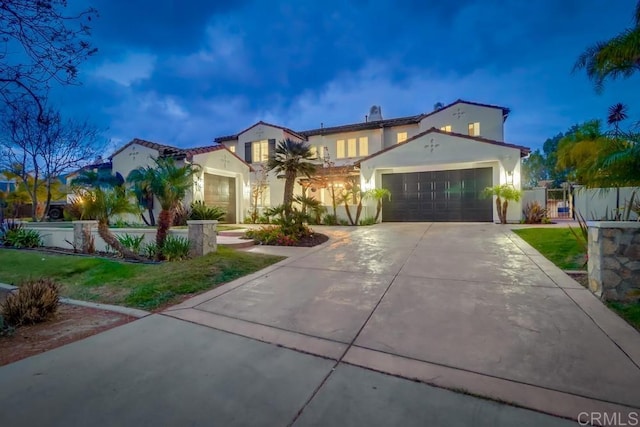 2850 Palmetto Point Ct, Chula Vista, CA 91915 - mediterranean / spanish home featuring stucco siding, driveway, a garage, and a gate