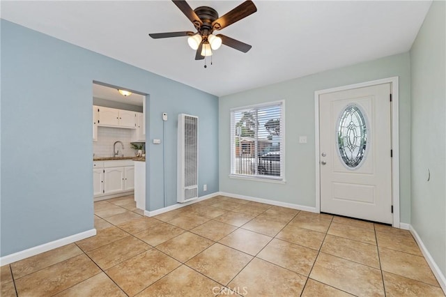 1048 S Record Ave, East Los Angeles, CA 90023 - entryway featuring a heating unit, light tile patterned floors, and a ceiling fan