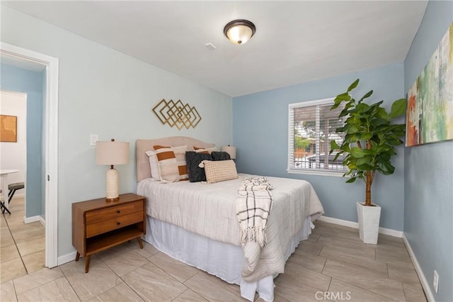 1048 S Record Ave, East Los Angeles, CA 90023 - bedroom featuring baseboards and light tile patterned floors