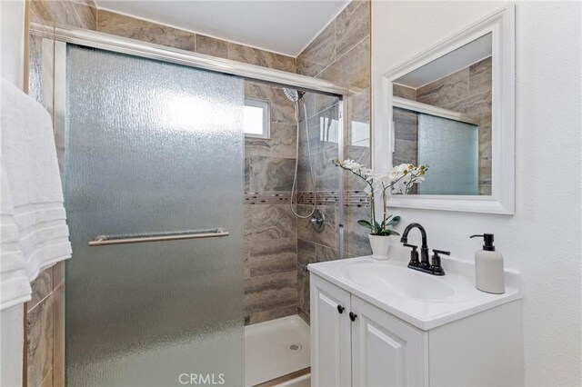 1048 S Record Ave, East Los Angeles, CA 90023 - bathroom with vanity and a stall shower