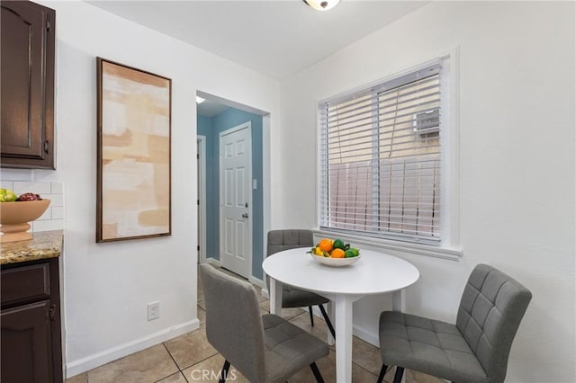 1048 S Record Ave, East Los Angeles, CA 90023 - dining area with light tile patterned flooring and baseboards