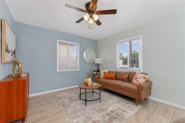 1048 S Record Ave, East Los Angeles, CA 90023 - living room featuring a ceiling fan and baseboards