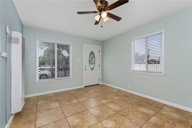1048 S Record Ave, East Los Angeles, CA 90023 - foyer featuring a heating unit, light tile patterned flooring, and a ceiling fan