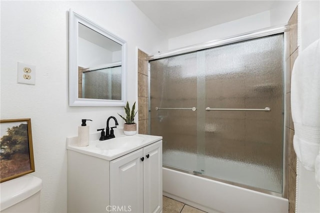 1048 S Record Ave, East Los Angeles, CA 90023 - bathroom with vanity, combined bath / shower with glass door, and tile patterned flooring