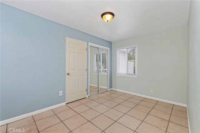 1048 S Record Ave, East Los Angeles, CA 90023 - empty room with baseboards and light tile patterned floors