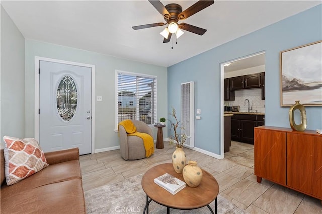 1048 S Record Ave, East Los Angeles, CA 90023 - living room featuring a heating unit and a ceiling fan